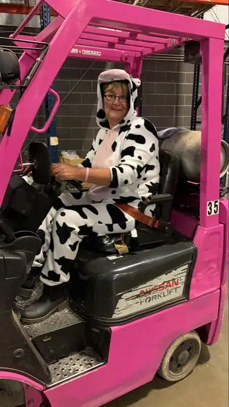 Employee operating a forklift dressed in a Halloween costume